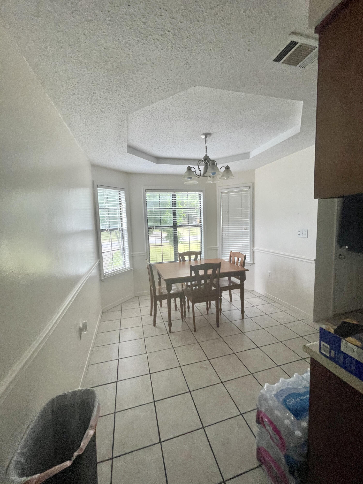 116 Springwood Circle Crestview, FL 32536 - Photo 5 of 14 a view of a dining room with furniture and chandelier