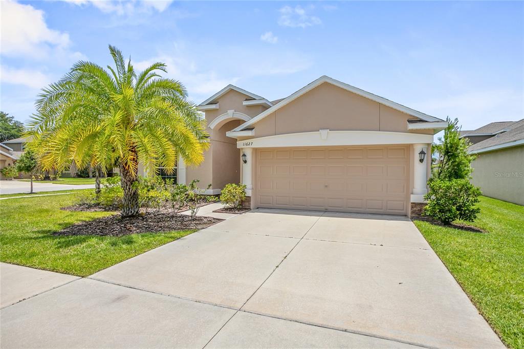 11627 Branch Cay Circle Riverview, FL 33569 - Photo 1 of 1 a view of a house with palm trees