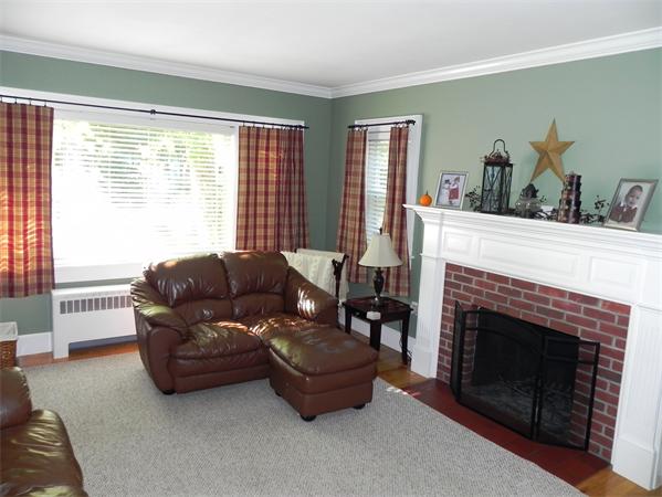 128 Goldthwaite Road Northbridge, MA 01588 - Photo 1 of 1 a living room with furniture and a fireplace