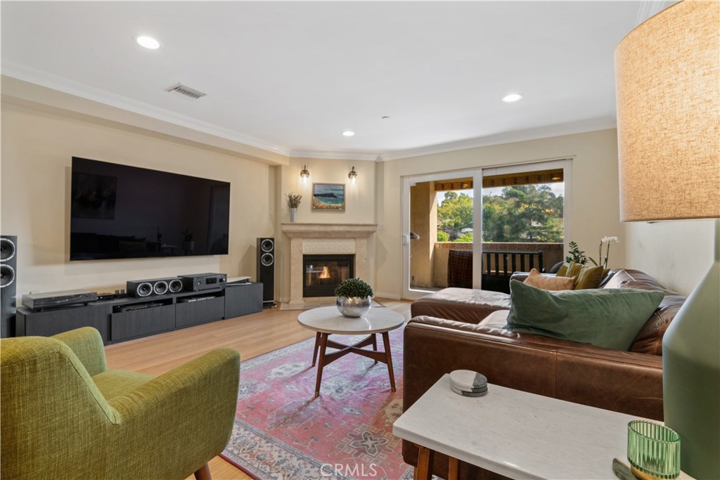 6221 Monterey Road, Unit 304 Highland Park, CA 90042 - Photo 16 of 33 a living room with furniture a flat screen tv and a large window