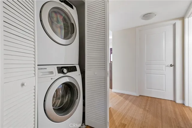 a view of a hallway with washer and dryer