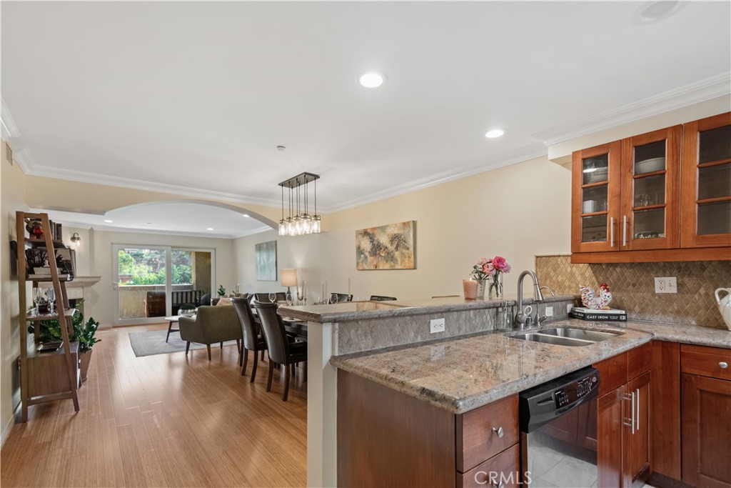 6221 Monterey Road, Unit 304 Highland Park, CA 90042 - Photo 8 of 33 a kitchen with a sink cabinets and wooden floor