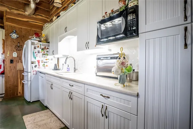 a bathroom with a sink a mirror and a shower