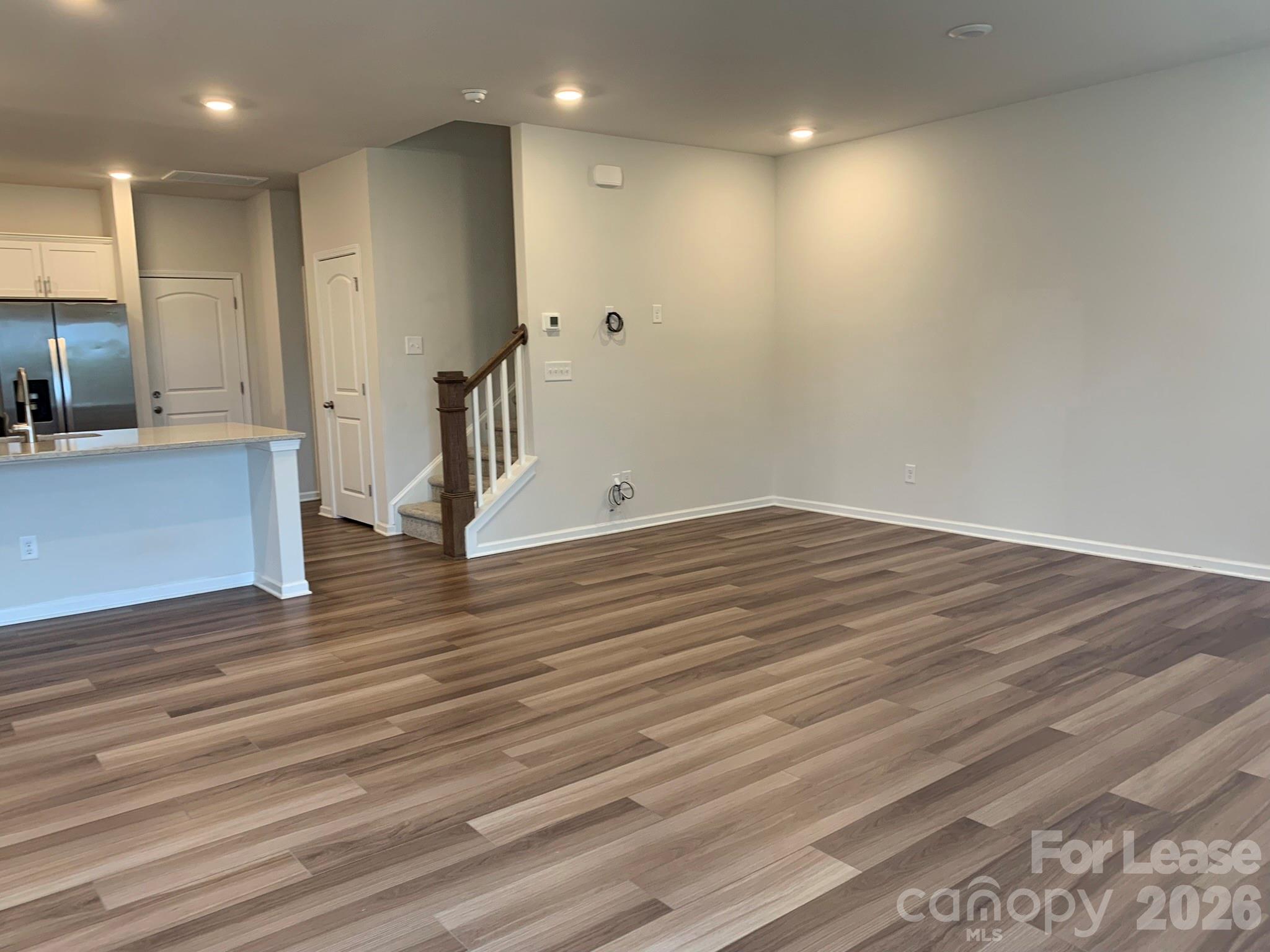 2143 Stevens Mill Road Matthews, NC 28104 - Photo 10 of 39 a view of empty room with wooden floor