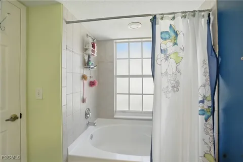 a bathroom with a shower and a bathtub