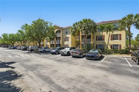 a view of a parked cars in front of a house