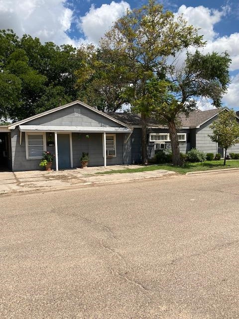 3520 26th Street Lubbock, TX 79410 - Photo 2 of 7 a front view of a building with a garden