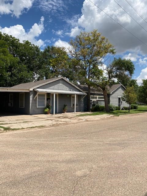 3520 26th Street Lubbock, TX 79410 - Photo 5 of 7 a front view of a house with a garden