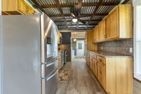 a kitchen with granite countertop lots of counter top space