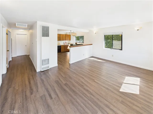 a view of kitchen with wooden floor