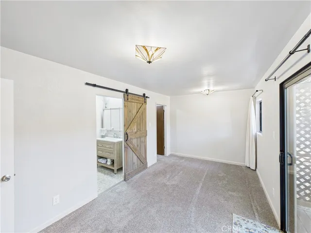 a view of a hallway with closet area