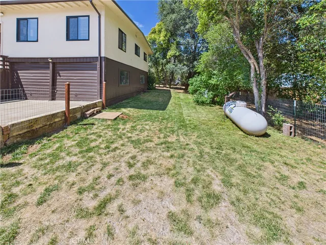 a view of balcony with wooden floor and fence