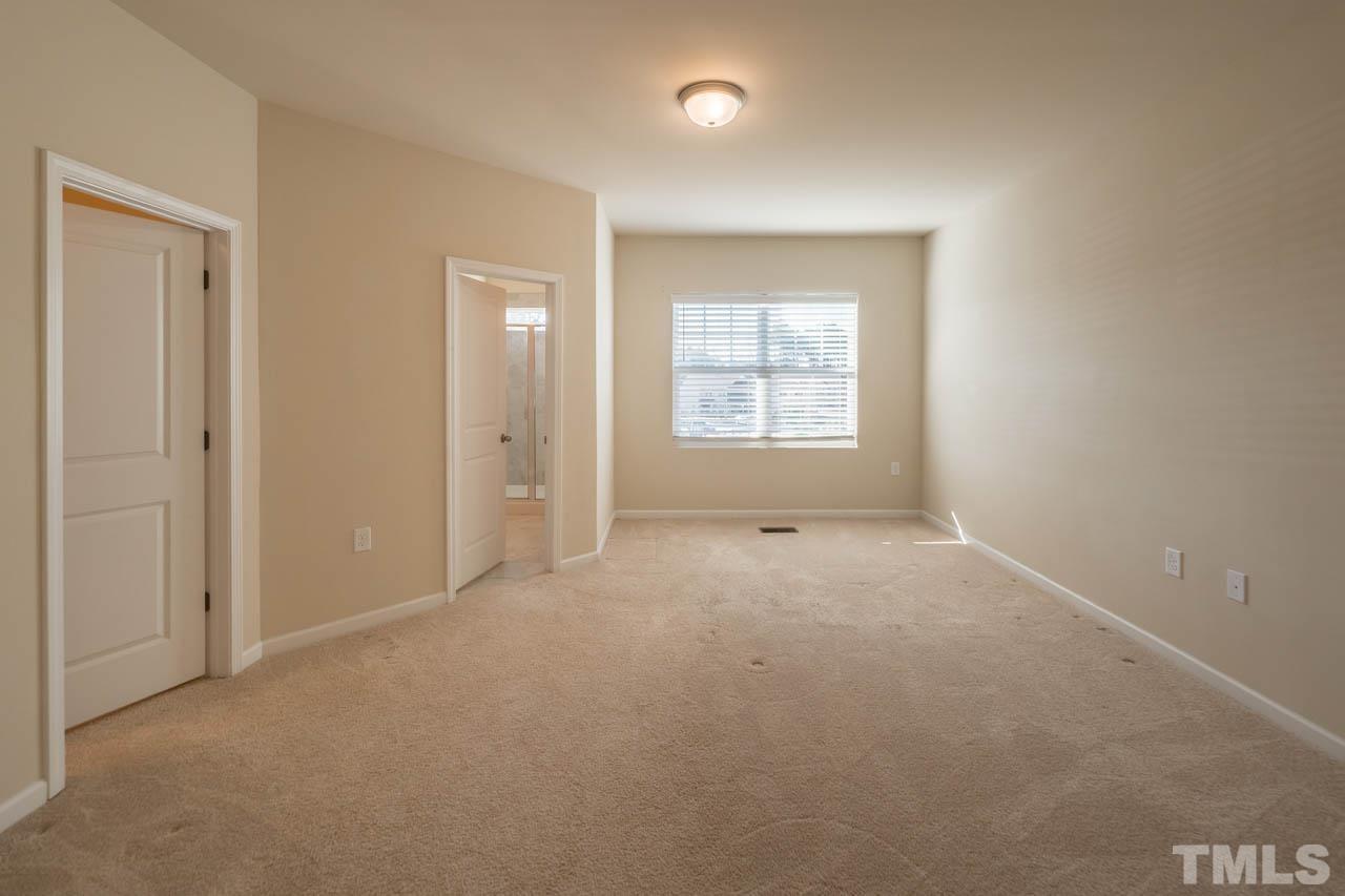 6072 Beale Loop Raleigh, NC 27616 - Photo 22 of 33 an empty room with windows and closet