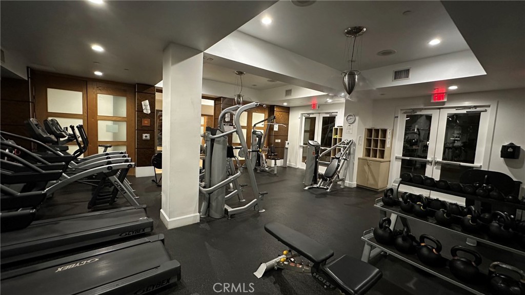 100 South Alameda Street, Unit 321 Los Angeles, CA 90012 - Photo 15 of 17 a view of a room with gym equipment