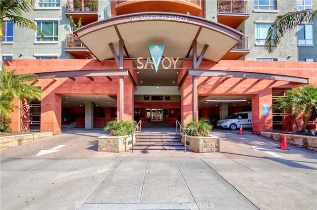 a view of a building with sitting area