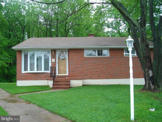 1502 Draper Court Rosedale, MD 21237 - Photo 1 of 10 a front view of a house with a yard