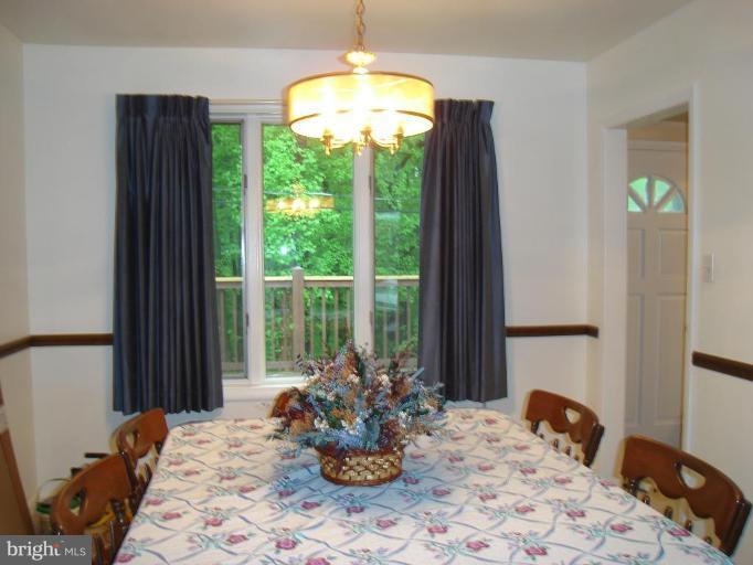 1502 Draper Court Rosedale, MD 21237 - Photo 4 of 10 a bed sitting in a bedroom next to a window