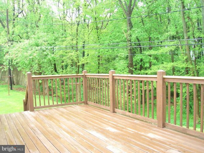 1502 Draper Court Rosedale, MD 21237 - Photo 6 of 10 a view of backyard with green space and wooden fence