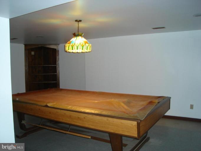 1502 Draper Court Rosedale, MD 21237 - Photo 9 of 10 a room with chandelier and table