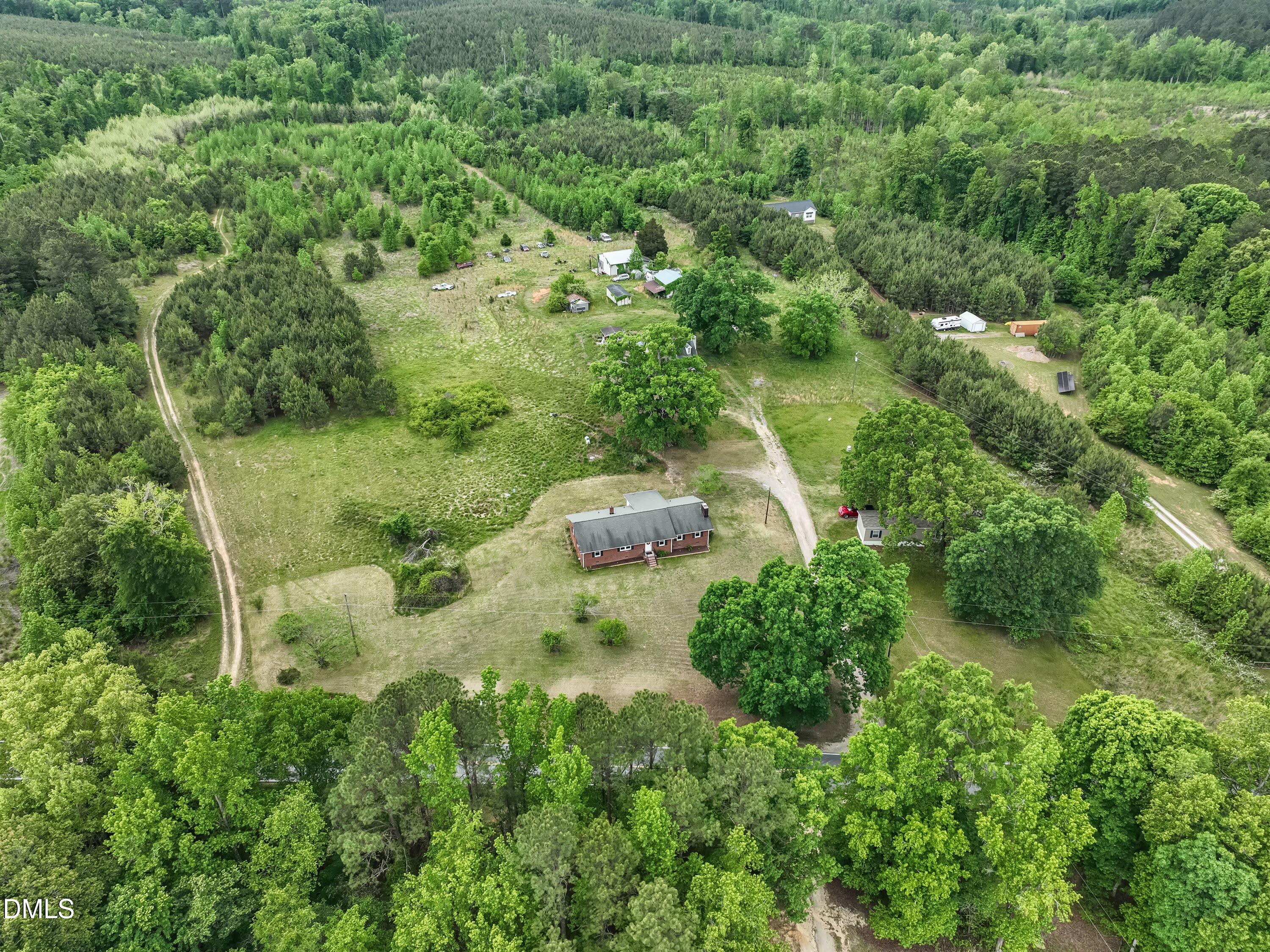 641 Rocky Ford Road Louisburg, NC 27549 - Photo 37 of 38 an aerial view of residential house with outdoor space and trees all around
