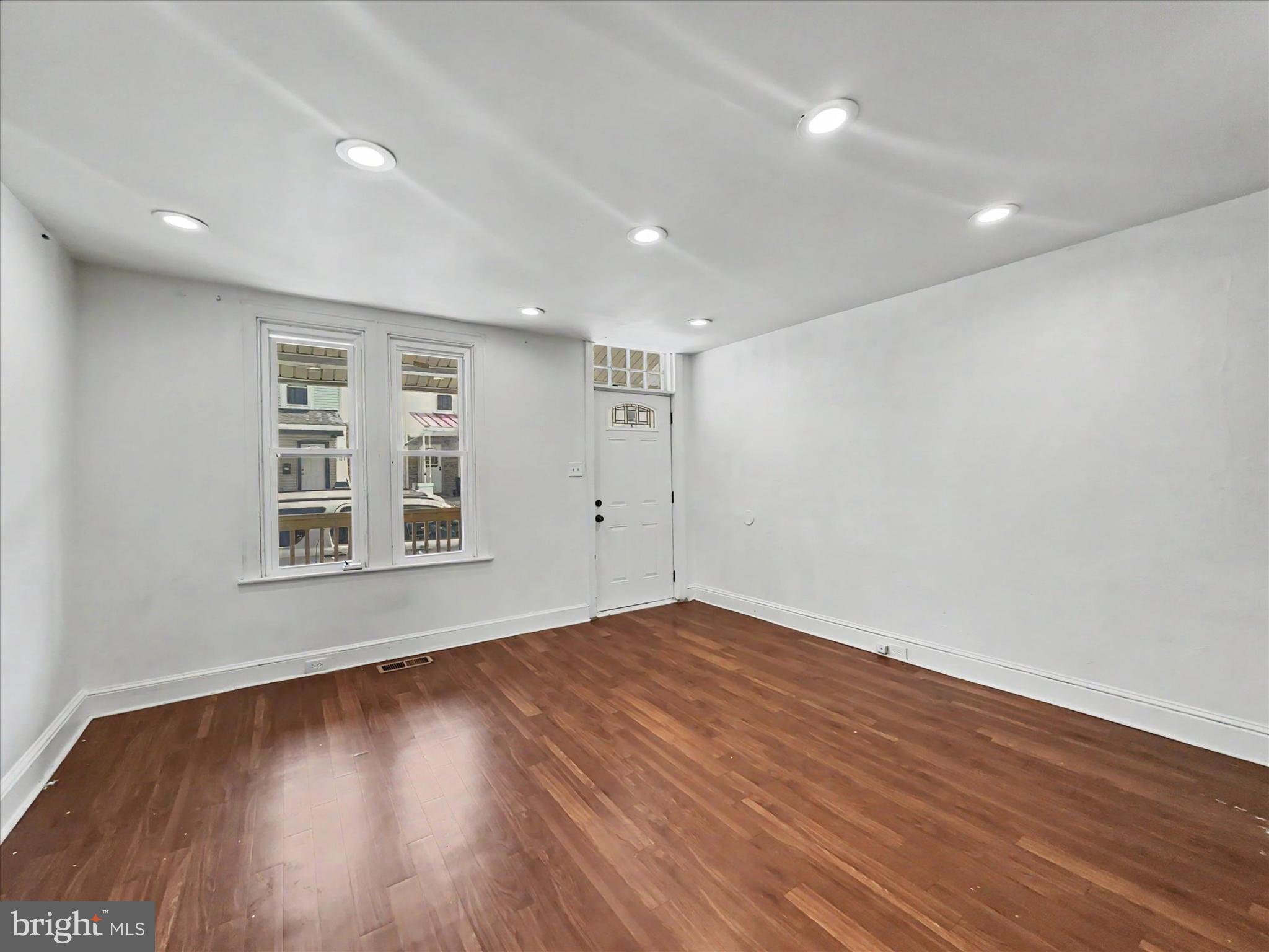 368 Norway Street York, PA 17403 - Photo 3 of 21 a view of an empty room with wooden floor and a window