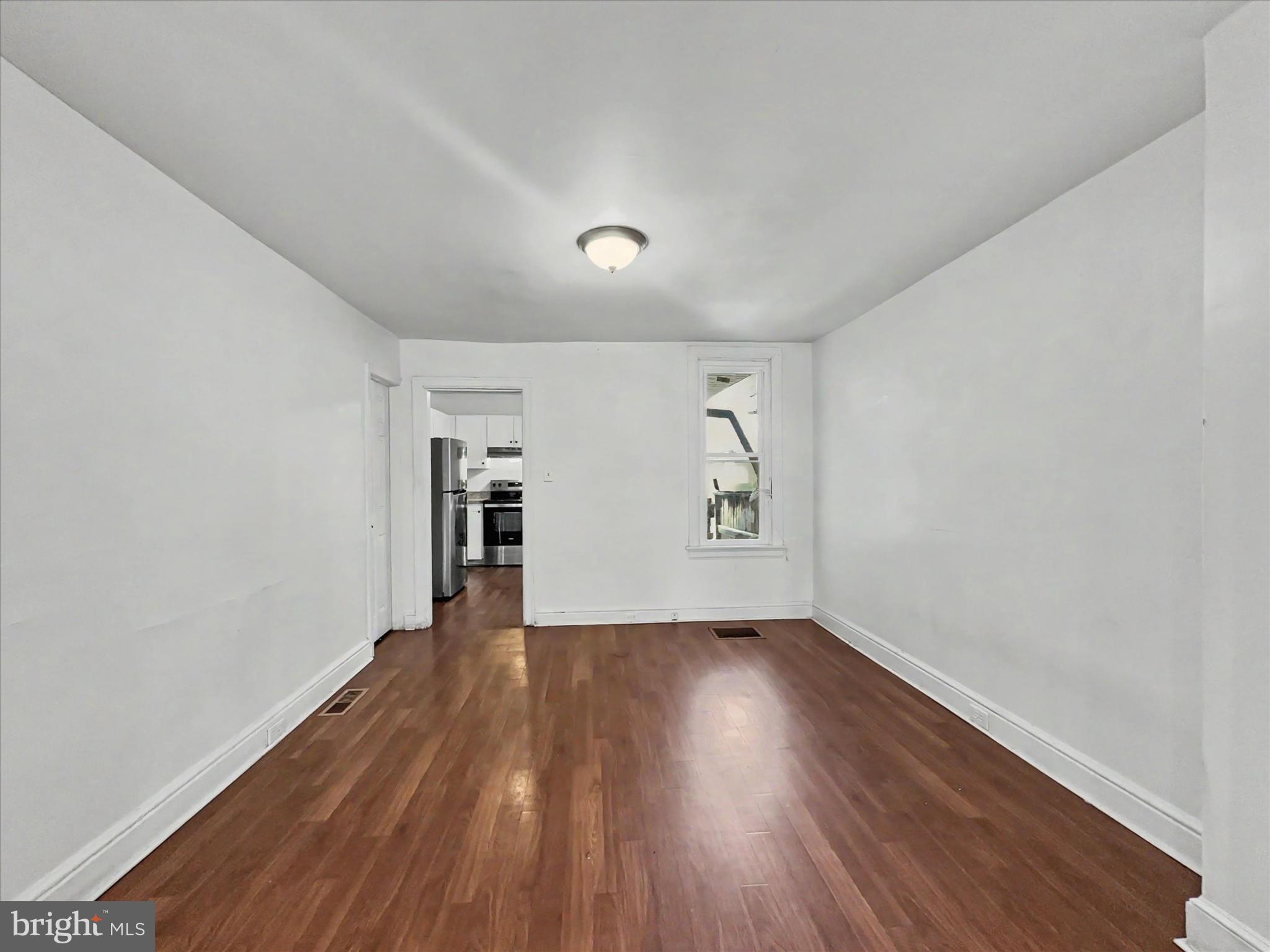 368 Norway Street York, PA 17403 - Photo 4 of 21 a view of an empty room with wooden floor and a window
