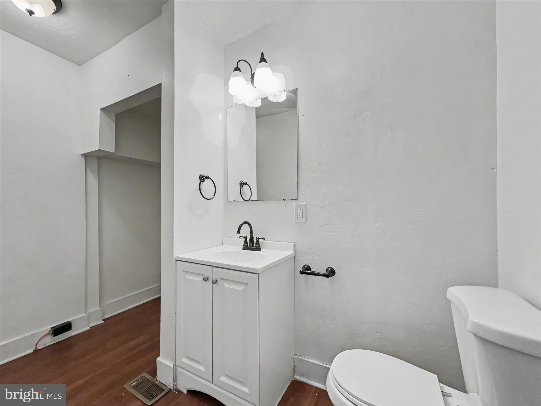 368 Norway Street York, PA 17403 - Photo 8 of 21 a bathroom with a toilet a sink and mirror