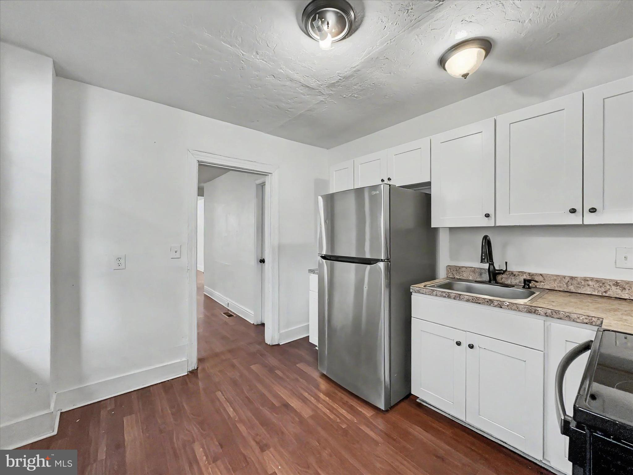 368 Norway Street York, PA 17403 - Photo 10 of 21 a kitchen with a refrigerator sink and cabinets