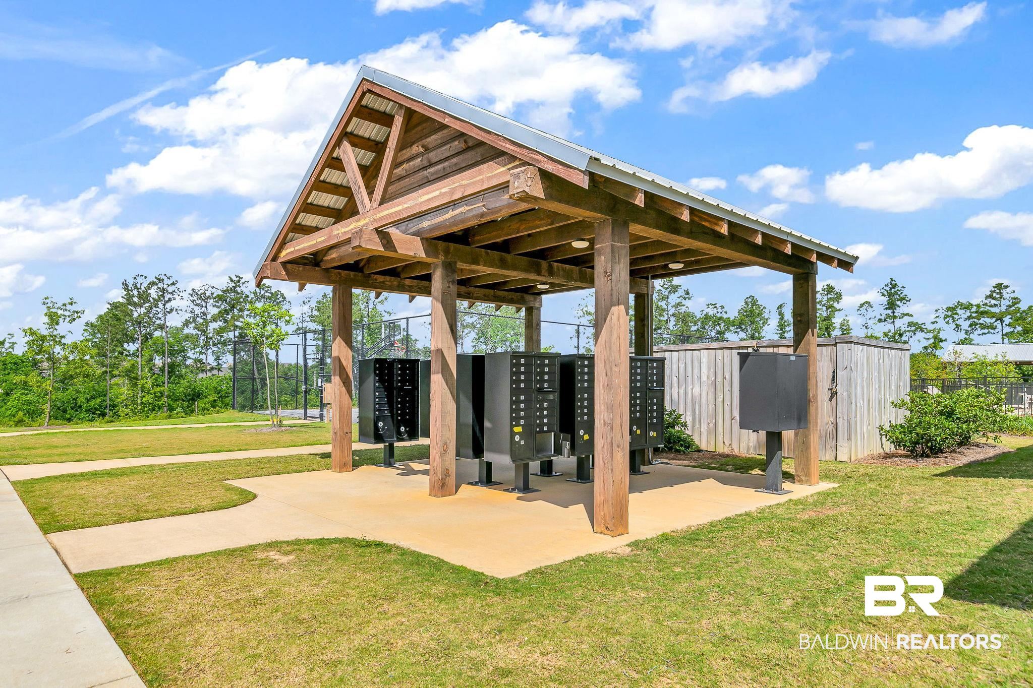 13233 Ibis Boulevard Daphne, AL 36527 - Photo 79 of 100 Covered outdoor structure featuring a metal roof and exposed wood beams