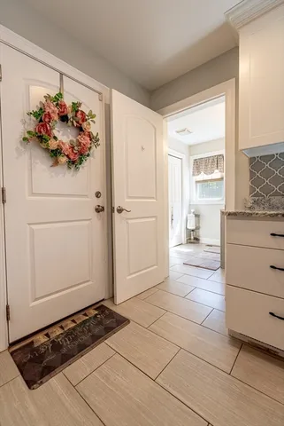 a bathroom with a sink vanity mirror and toilet