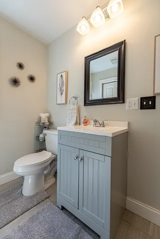 a bedroom with furniture and a flat screen tv
