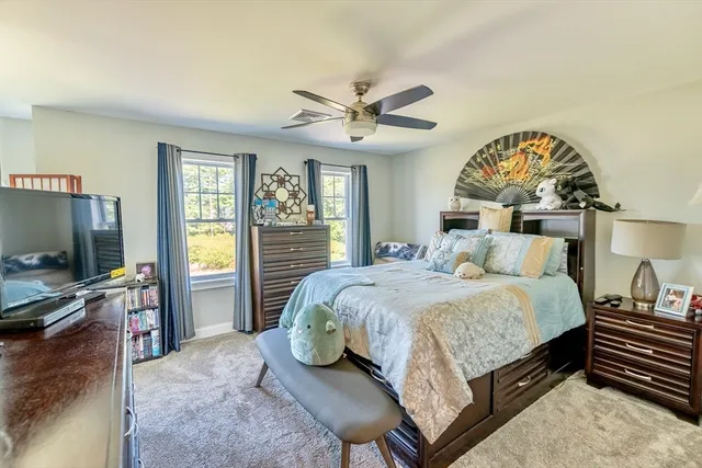 a bedroom with a bed furniture and window