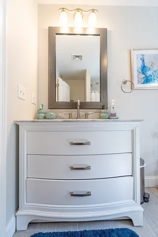 a view of a patio with a table and chairs under an umbrella