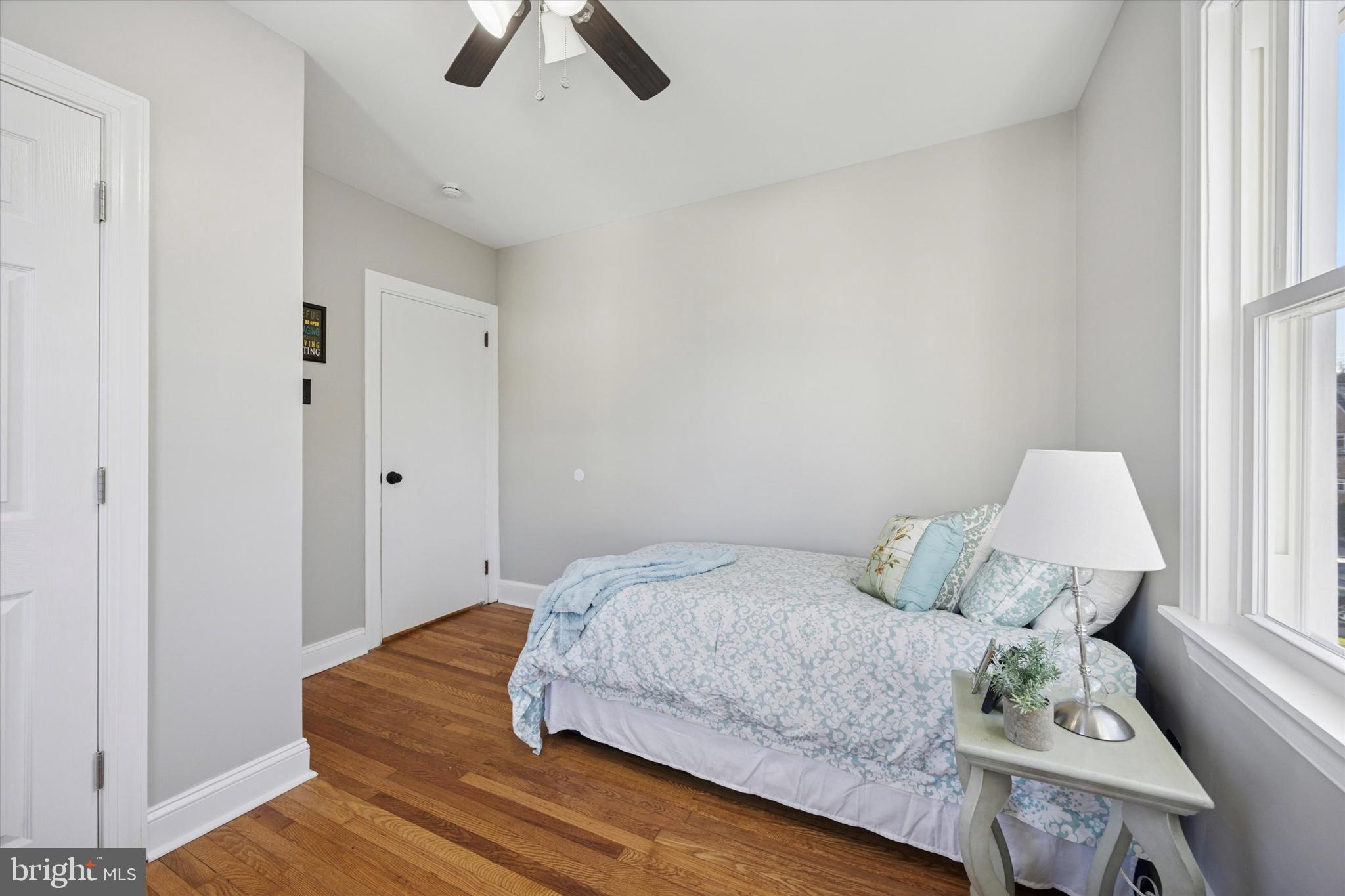 110 Sycamore Road Havertown, PA 19083 - Photo 16 of 25 a bedroom with a bed and wooden floor