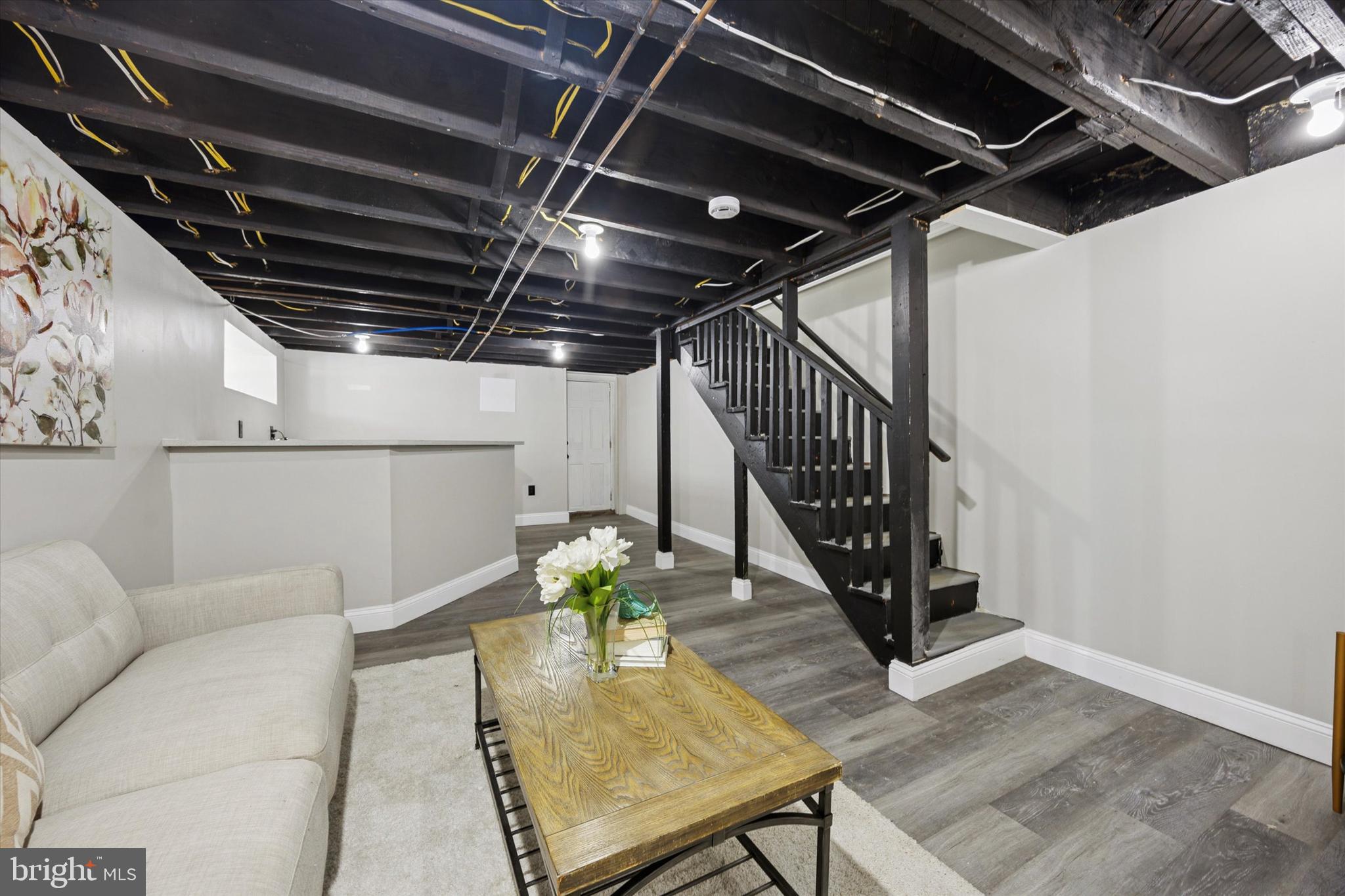 110 Sycamore Road Havertown, PA 19083 - Photo 20 of 25 a living room with wooden floors and stairs