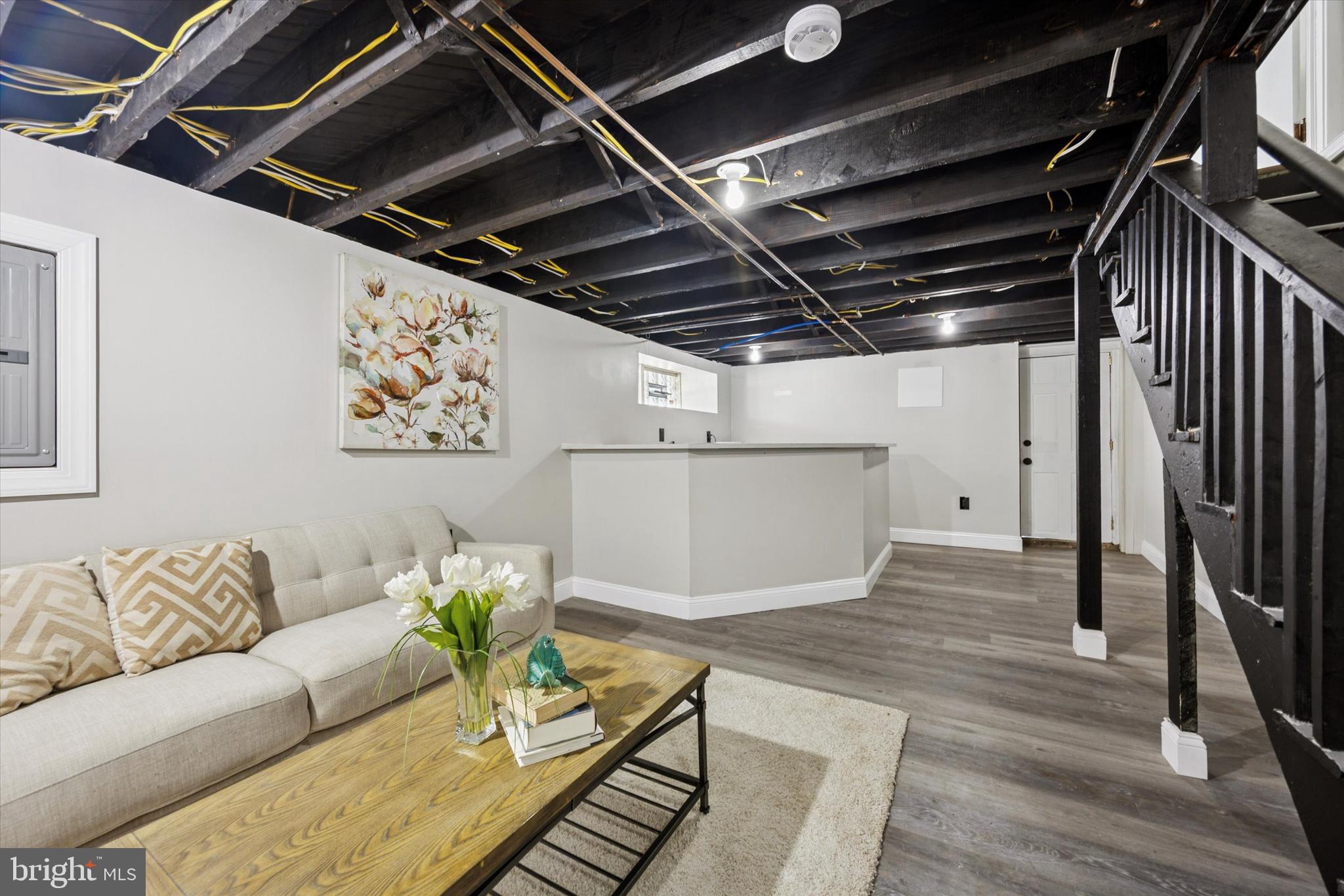 110 Sycamore Road Havertown, PA 19083 - Photo 21 of 25 a living room with furniture and wooden floor