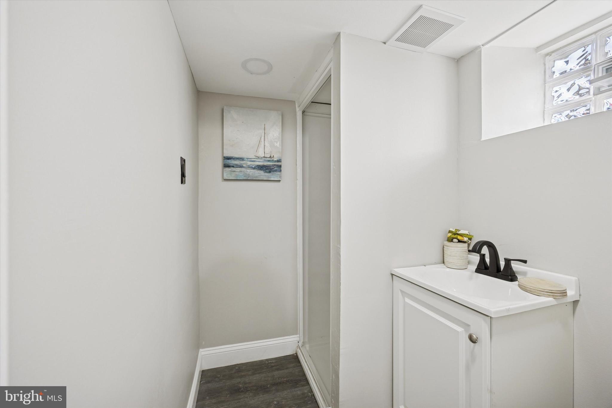 110 Sycamore Road Havertown, PA 19083 - Photo 23 of 25 a bathroom with a sink and mirror