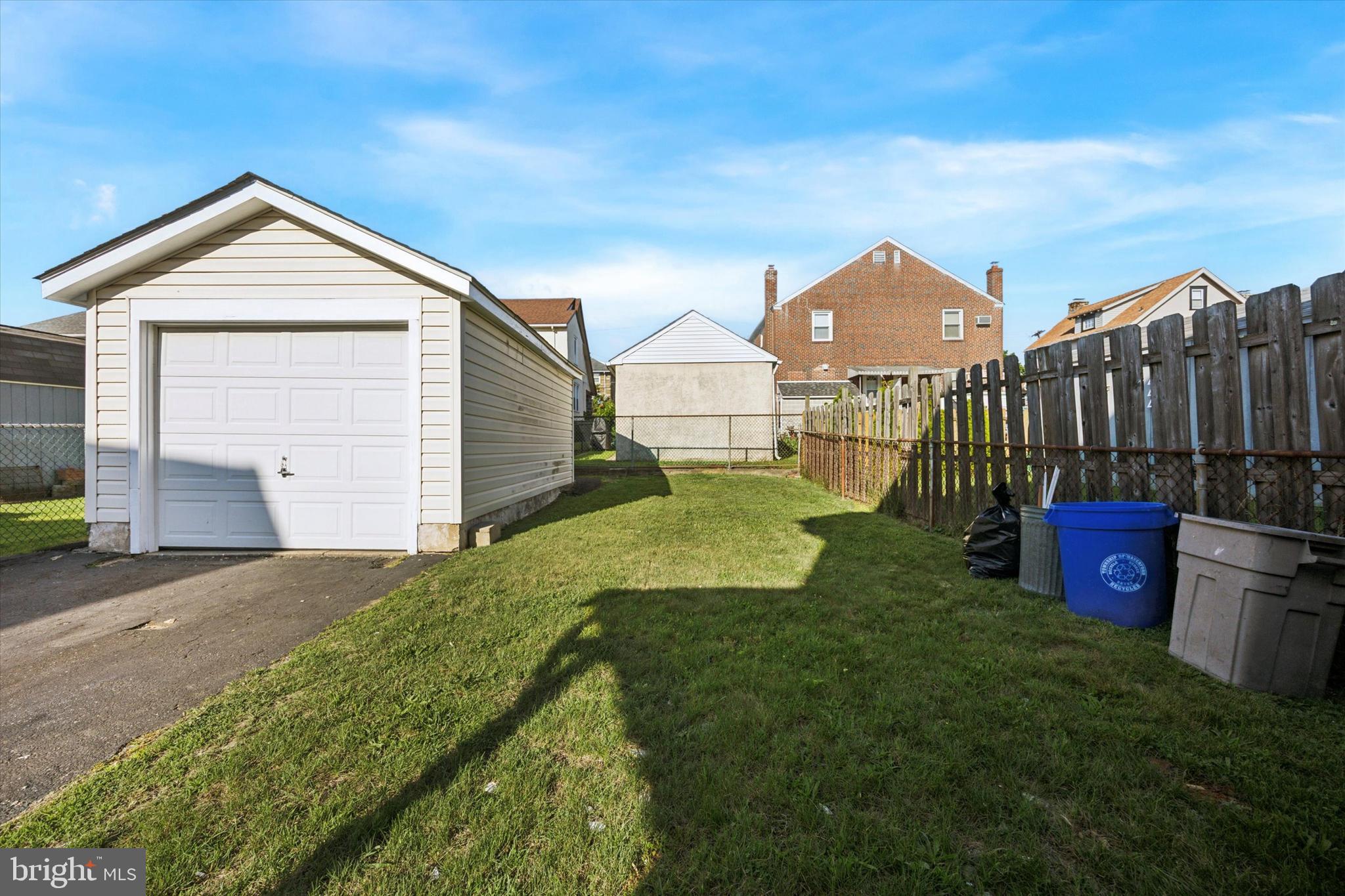 110 Sycamore Road Havertown, PA 19083 - Photo 25 of 25 a front view of a house with a yard and garage