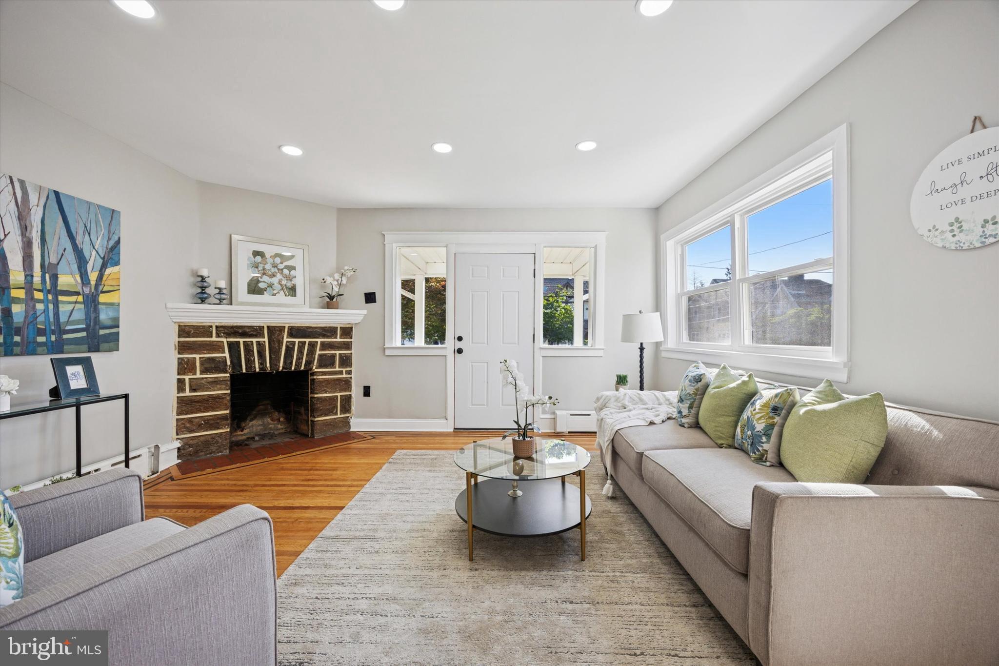 110 Sycamore Road Havertown, PA 19083 - Photo 4 of 25 a living room with furniture and a fireplace
