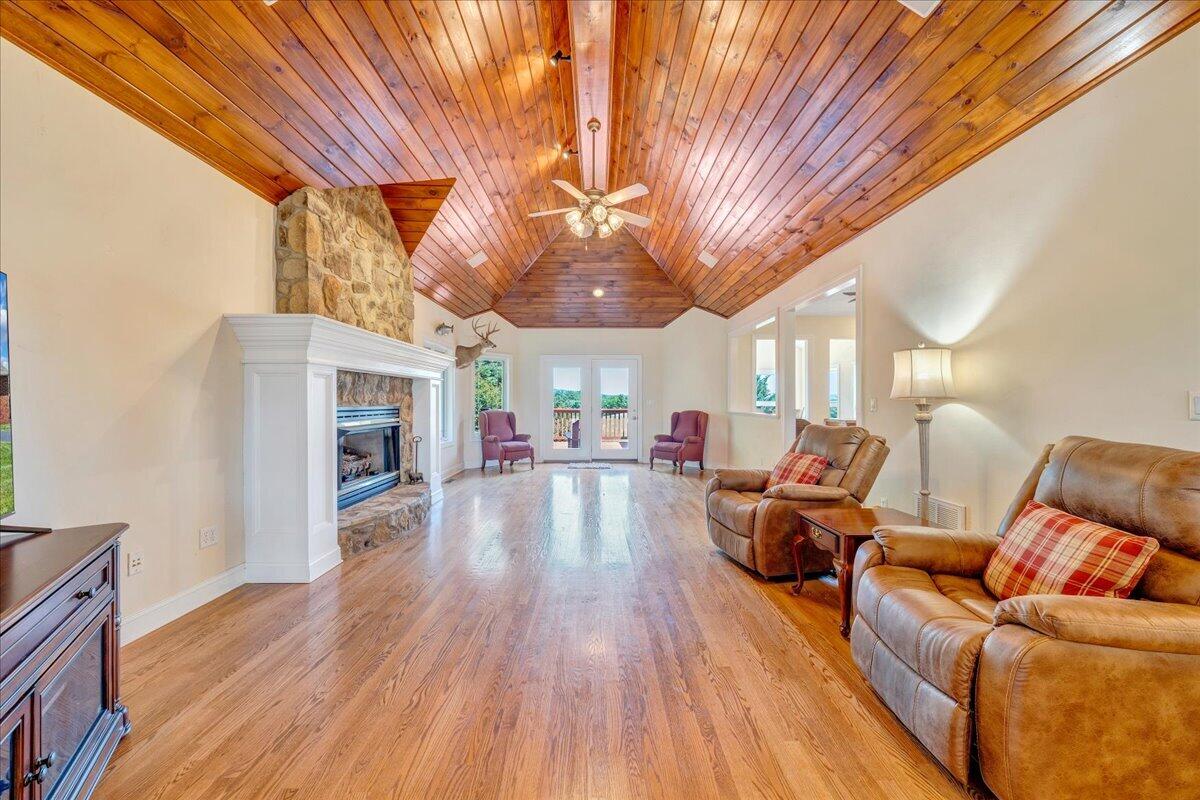 625 Frontier Way Fincastle, VA 24090 - Photo 12 of 105 a living room with furniture and a fireplace
