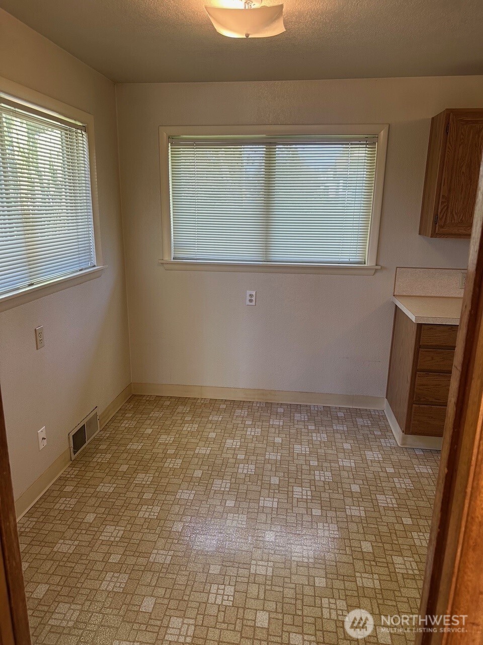 3504 Northeast 135th Street Seattle, WA 98125 - Photo 14 of 35 a view of an empty room with a window