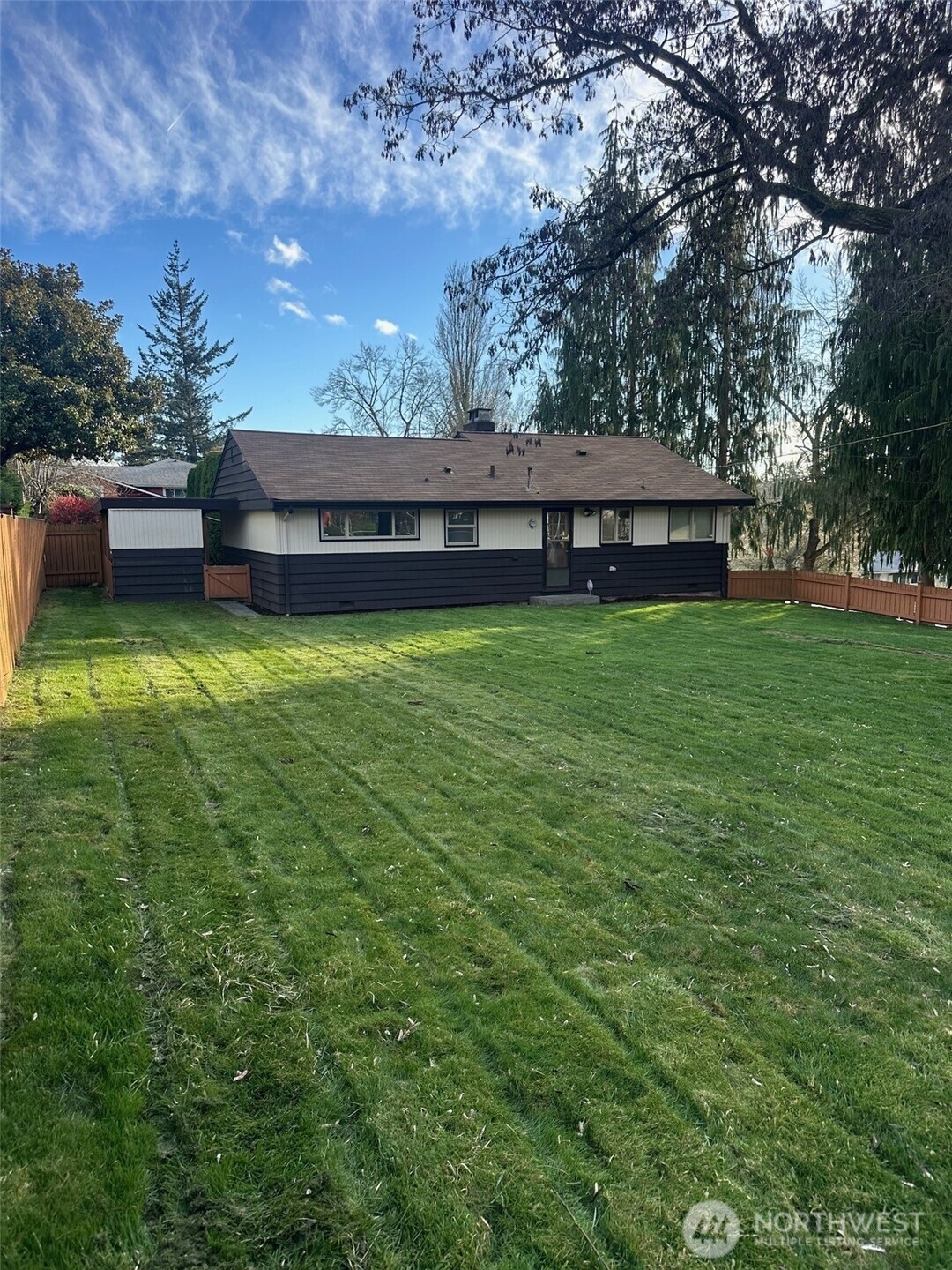 3504 Northeast 135th Street Seattle, WA 98125 - Photo 2 of 35 a backyard of a house with lots of green space