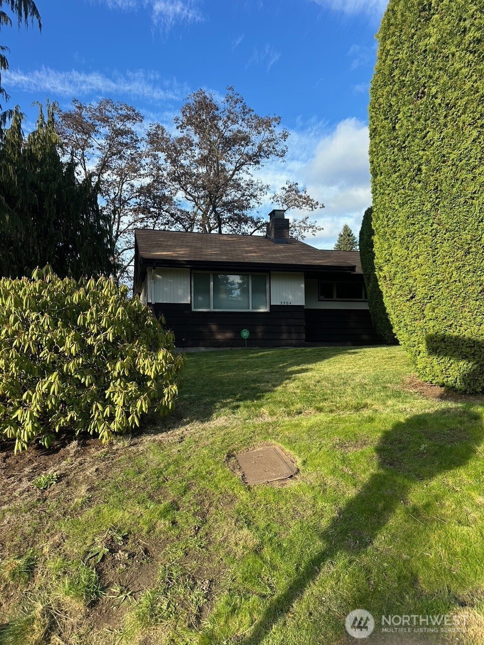 3504 Northeast 135th Street Seattle, WA 98125 - Photo 26 of 35 a view of a house with a yard