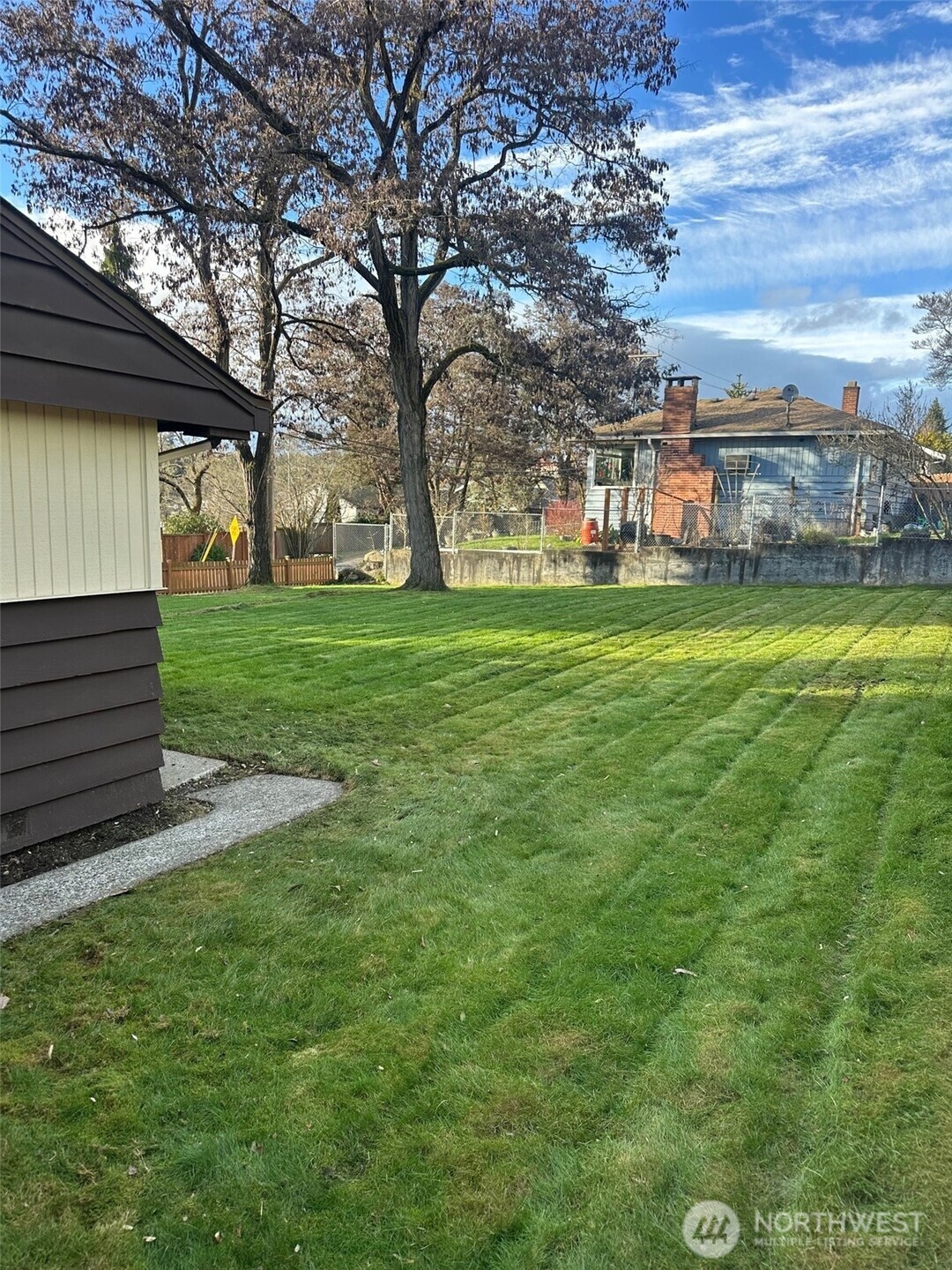 3504 Northeast 135th Street Seattle, WA 98125 - Photo 30 of 35 a view of a house with a yard