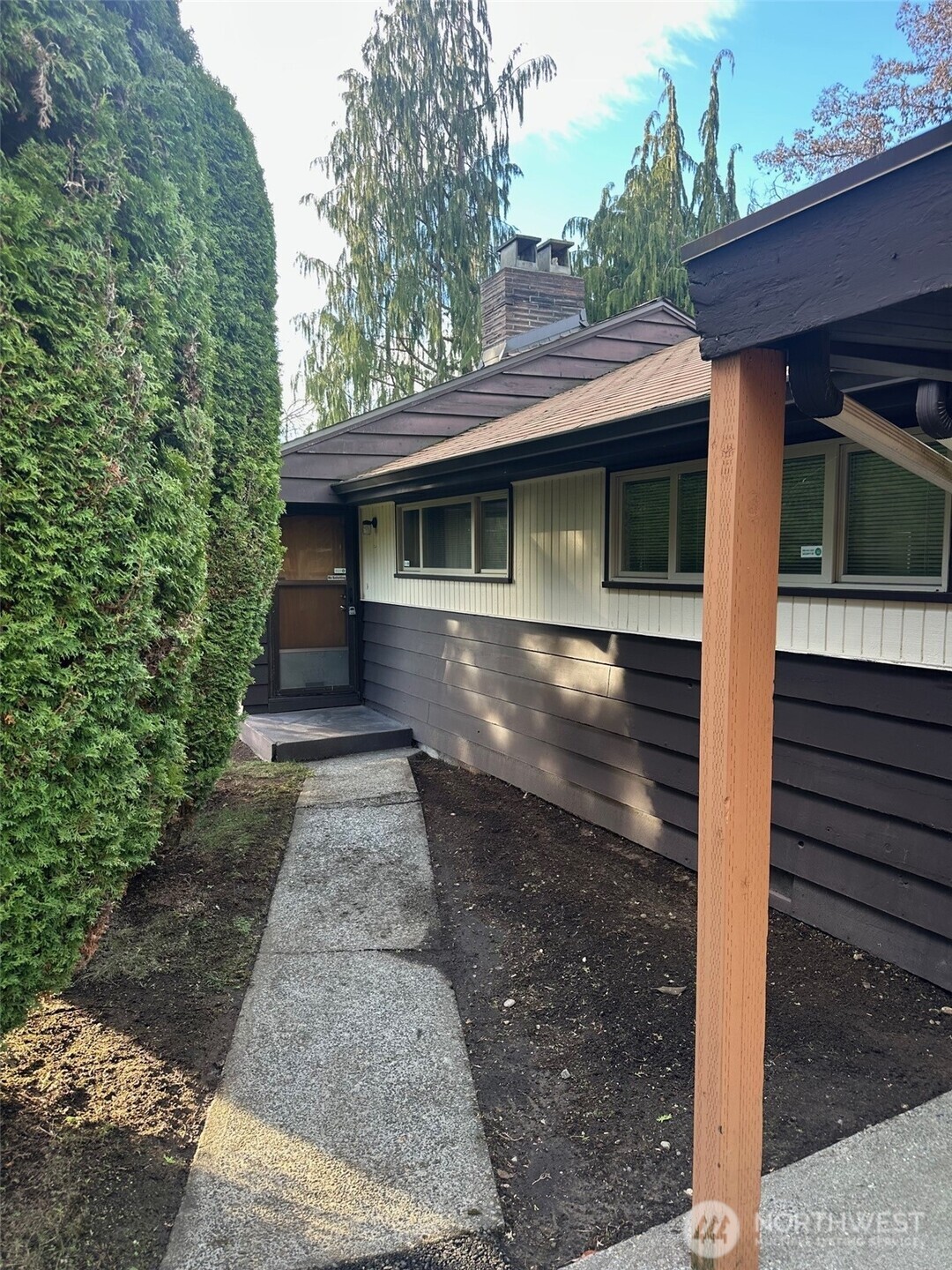 3504 Northeast 135th Street Seattle, WA 98125 - Photo 3 of 35 a front view of a house with a yard