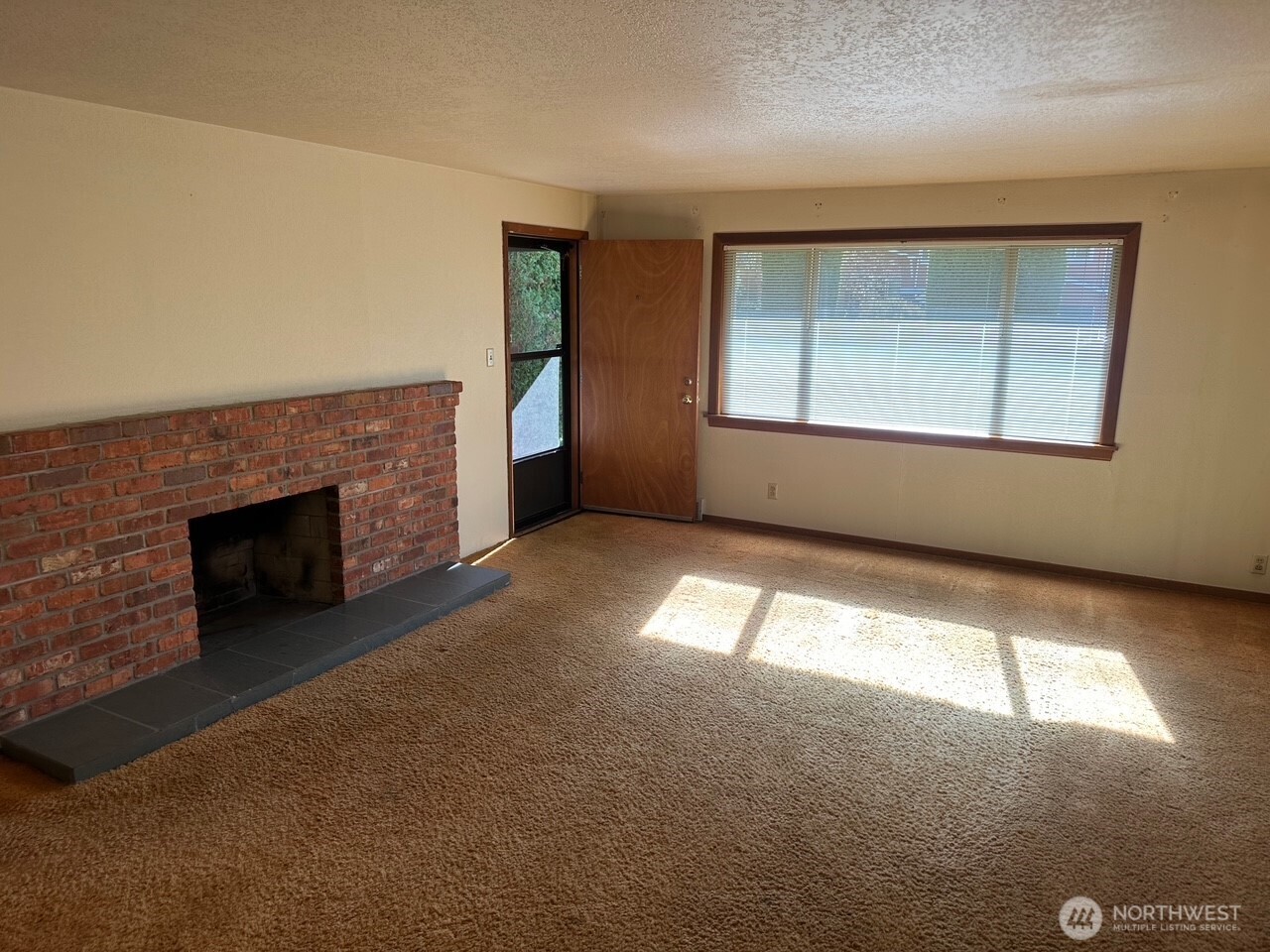 3504 Northeast 135th Street Seattle, WA 98125 - Photo 5 of 35 an empty room with windows