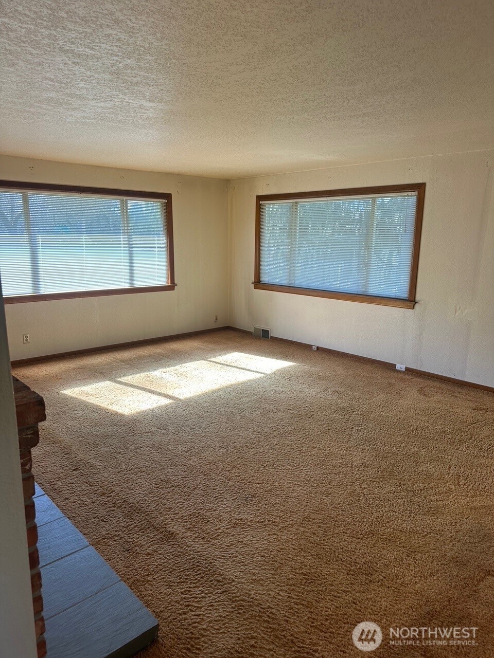 3504 Northeast 135th Street Seattle, WA 98125 - Photo 6 of 35 a view of an empty room with window