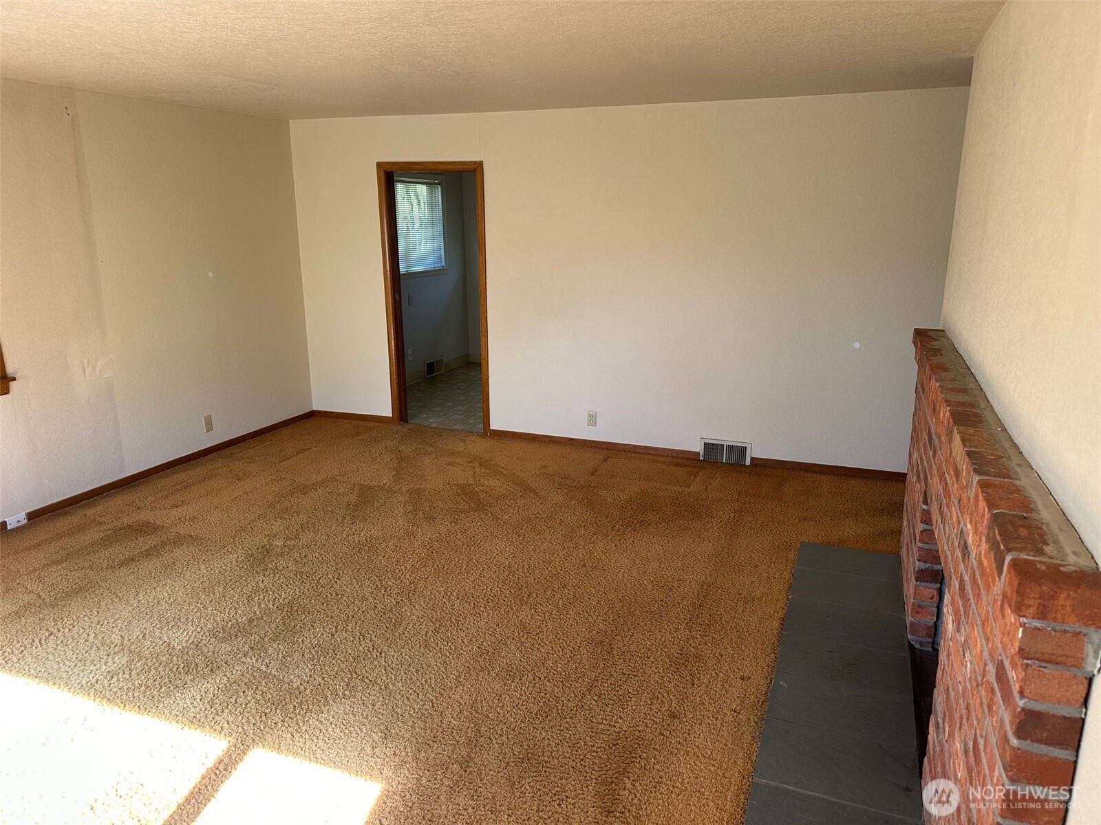 3504 Northeast 135th Street Seattle, WA 98125 - Photo 7 of 35 an empty room with wooden floor