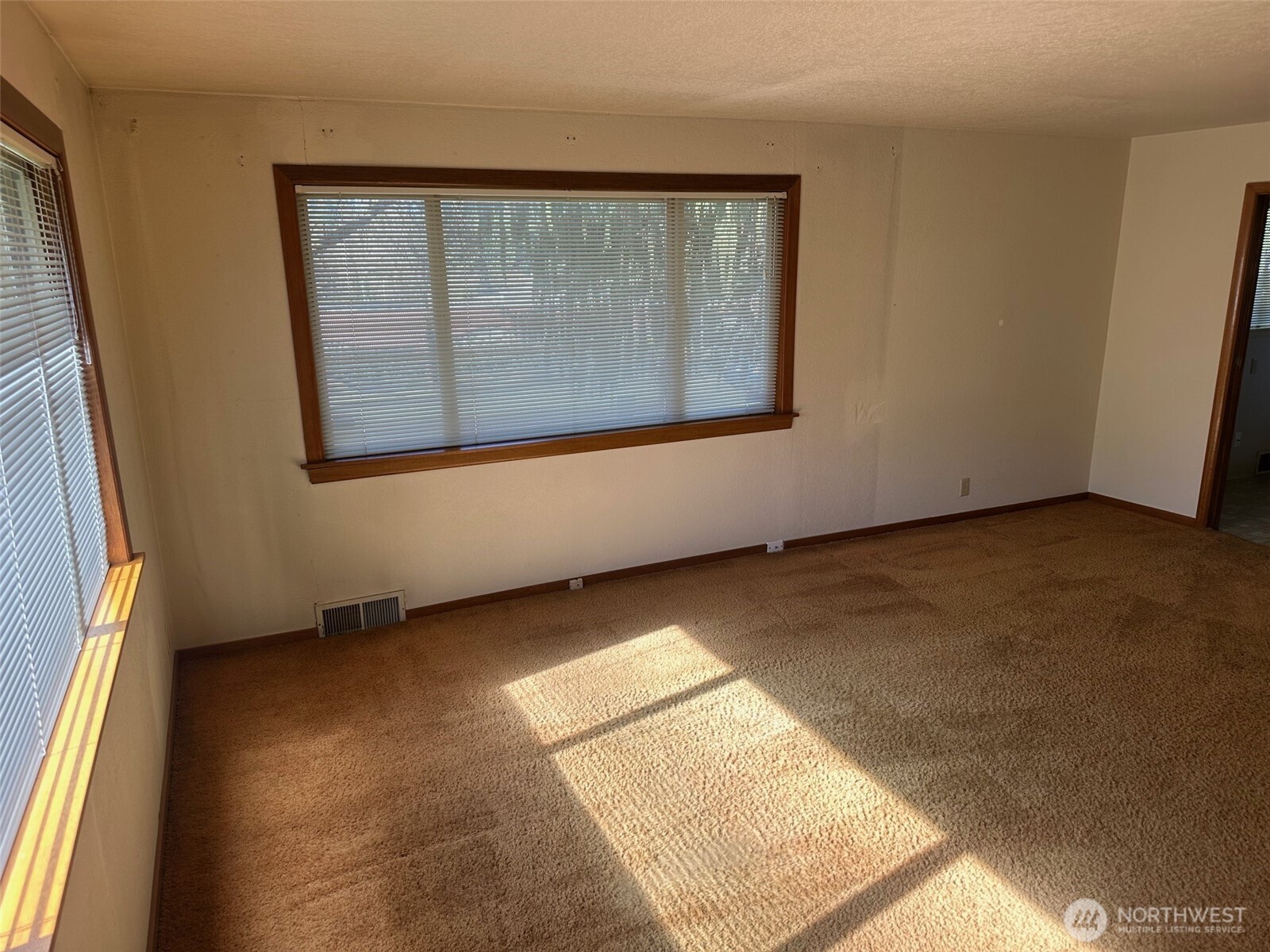 3504 Northeast 135th Street Seattle, WA 98125 - Photo 9 of 35 a view of an empty room with a window