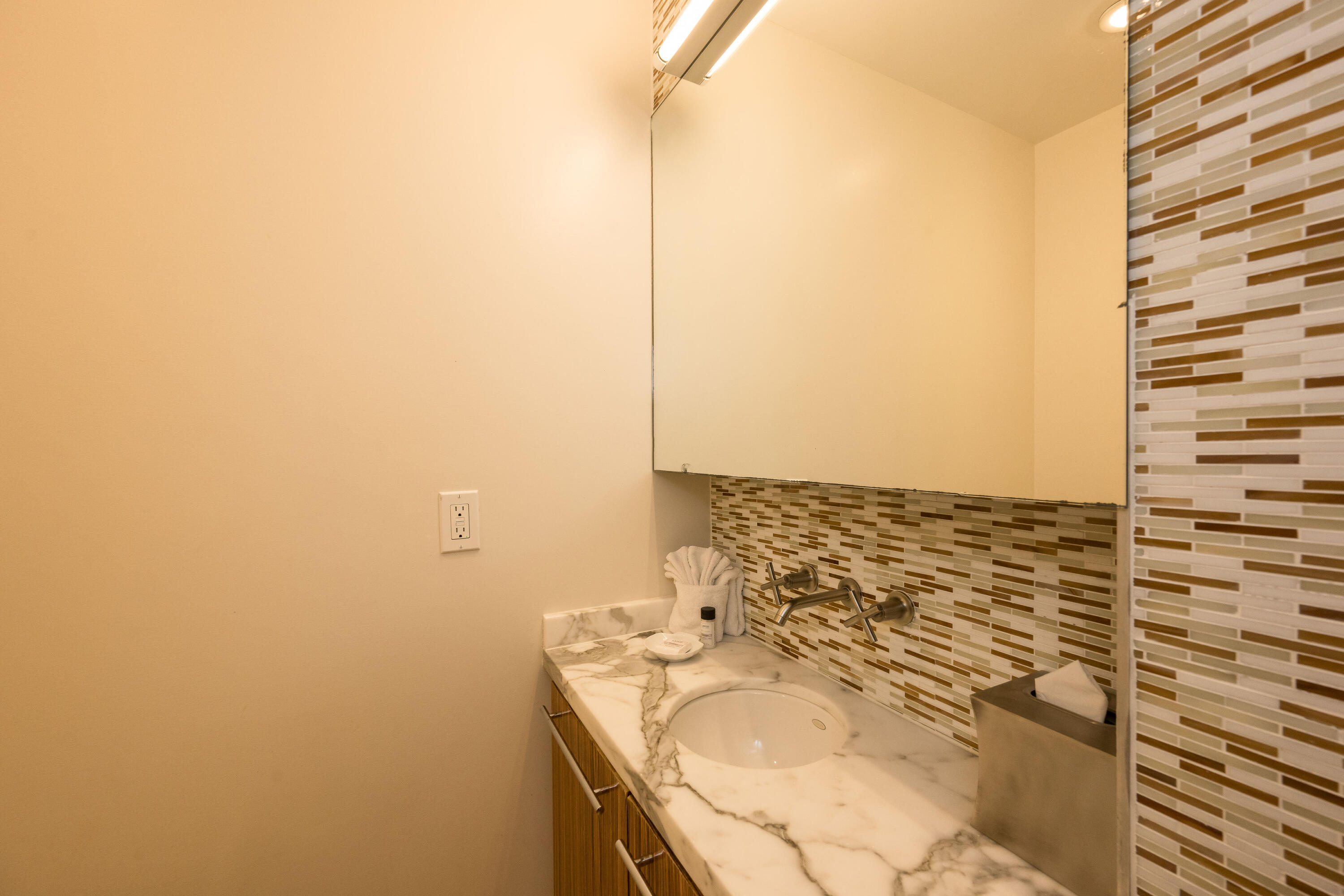 1401 Simonton Street, Unit 20 Key West, FL 33040 - Photo 12 of 32 a bathroom with a granite countertop sink and a mirror